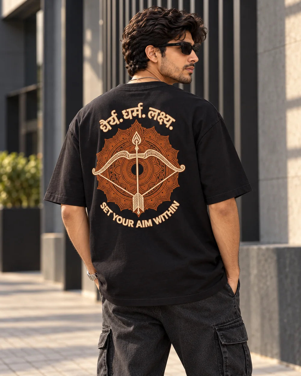Dhairya. Dharma. Lakshya. — Black T-shirt, back view