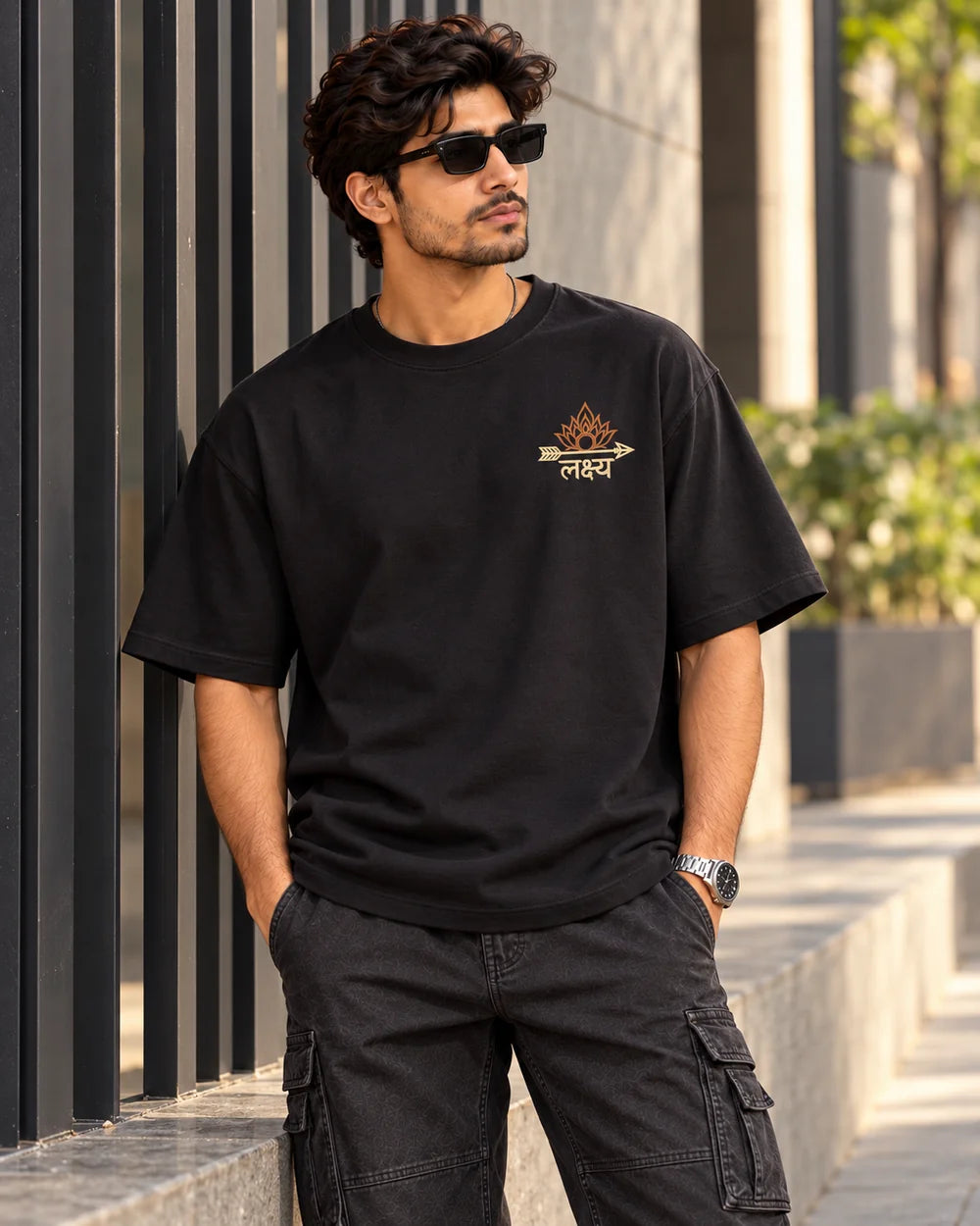 Dhairya. Dharma. Lakshya. | 220 GSM Oversized T-shirt — Black · Front model view